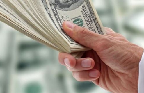 10349421 - hand of businessman holding dollars