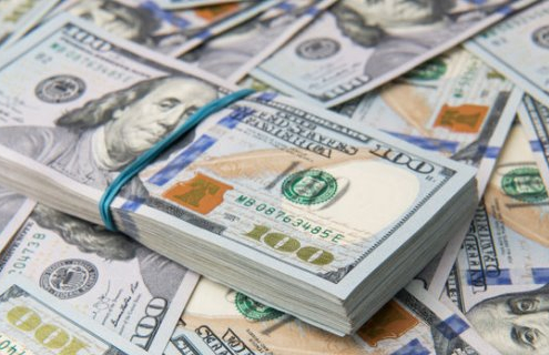 Stack of one hundred dollar bills close-up.