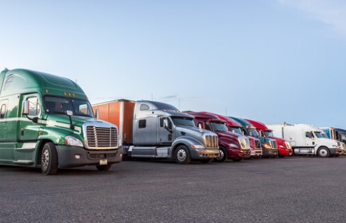 several trucks parked in parking lot_canstockphoto21151162 770x320