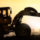 heavy machinery silhouette against sunset_canstockphoto22611529 770x320