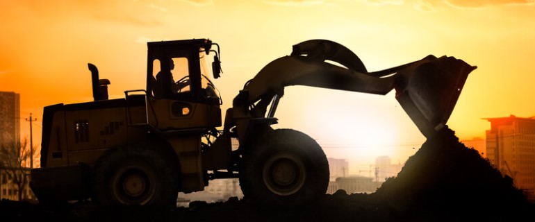 heavy machinery silhouette against sunset_canstockphoto22611529 770x320